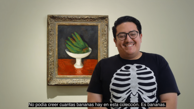 Justin Favela in front of painting