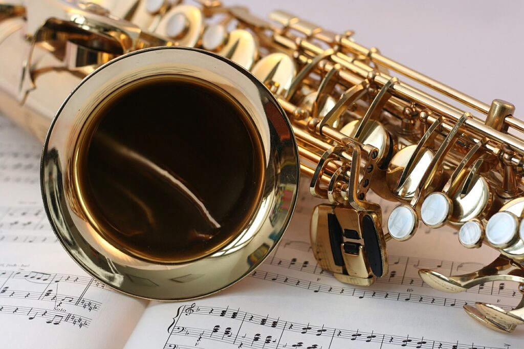 saxophone laying on sheet music