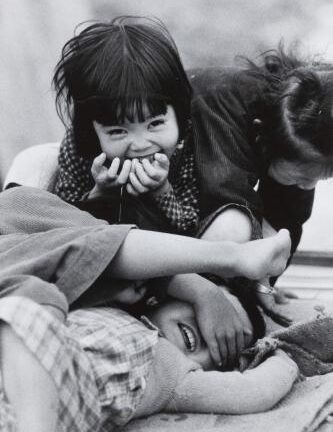 Black and white photograph by Ken Heyman of young children playing