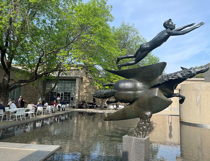 Carl Milles' "Man and Pegasus" sculpture in Art Center courtyard on a bright summer day