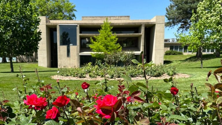 I.M. Pei building from the outside, with red roses in the foreground of the picture.