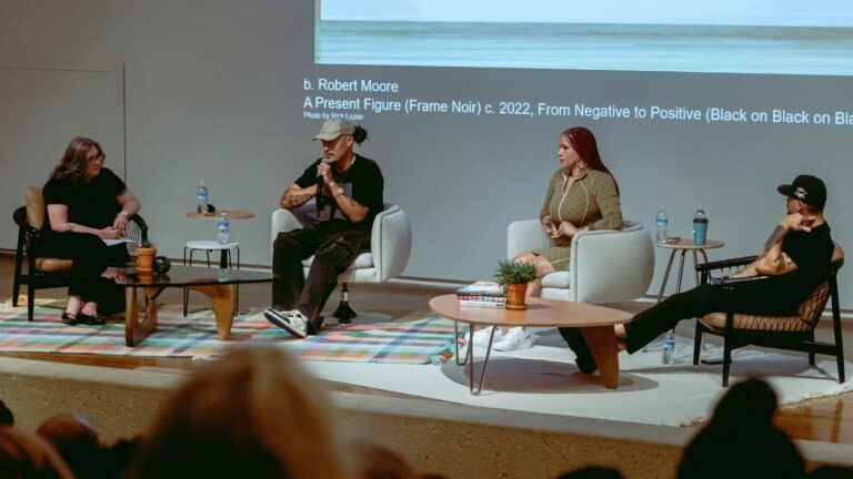 Four people sitting on stage for panel discussion - from left to right: Laura Burkhalter, b. Robert Moore, Nikole Hannah-Jones, Jordan Weber