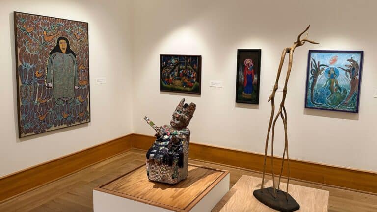 Gallery showing various works of art from the exhibition, "Light Within Ourselves: Haitian Art in Iowa."