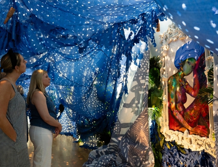Opening celebration event of Firelei Báez. Two women standing in an art installation: Firelei Báez (Dominican, born 1981) “A Drexcyen chronocommons (To win the war you fought it sideways),” 2019