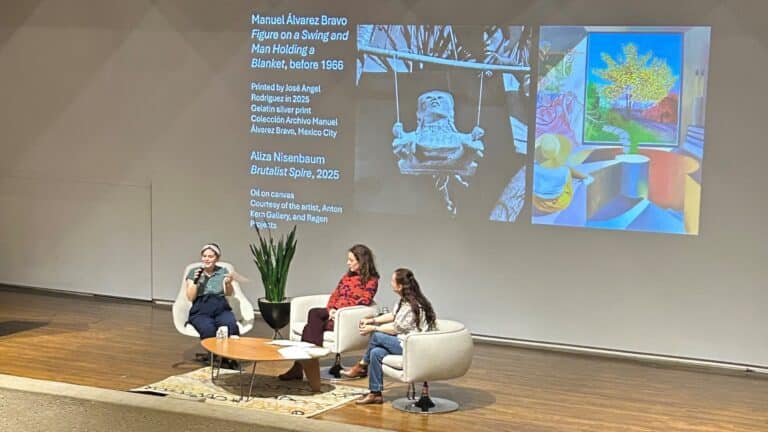 Three women sitting on stage; panel discussion: “Manuel Álvarez Bravo: Collaborations” features Aurelia Álvarez Urbajtel (Director of the Manuel Álvarez Bravo Foundation in Mexico City), Aliza Nisenbaum (2024-25 Toni and Tim Urban International Artist in Residence), and Mia Laufer (exhibition curator) in conversation about the renowned photographer Manuel Álvarez Bravo.